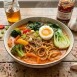 Creamy gochujang ramen with soft egg and sesame