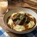 Slow cooker beef tips and gravy over mashed potatoes
